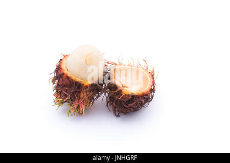 Rotten rambutan fruit on wooden background Stock Photo