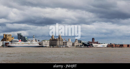 A multiple image panorama of the cruise ship MV Boudicca berthed on the Liverpool waterfront, captured under a stormy sky during the summer of 2017. Stock Photo