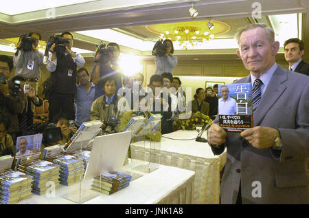 TOKYO, Japan - Charles Jenkins, a former U.S. army deserter to North Korea, poses for photos with his memoir in hands at a press conference in Tokyo on Oct. 112  ''I hope that this book will help the abduction issue in a small way,'' said Jenkins, the 65-year-old husband of repatriated Japanese abductee Hitomi Soga. (Kyodo)
