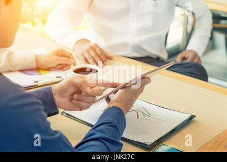 Business team present. Photo professional investor working new startup business project. Finance business meeting. Digital tablet laptop computer smar Stock Photo