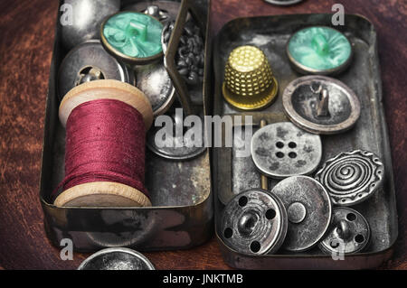 Stylish metal buttons for clothes in retro box Stock Photo