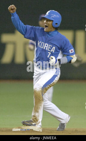 South Korea's Jong Beom Lee (#7) and Seung Youp Lee(#25) celebrate after  their