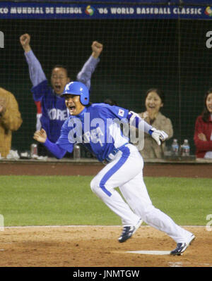 South Korea's Jong Beom Lee (#7) and Seung Youp Lee(#25) celebrate after  their