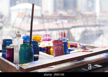 Color jars and tempera on working table in ceramic laboratory in turkey Stock Photo