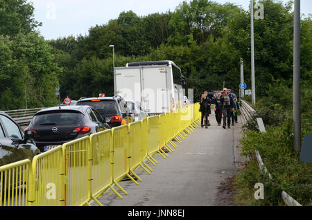 Sonderborg, Denmark - July 30, 2017: Guides direct the heavy traffic at the end of a scout camp. Stock Photo