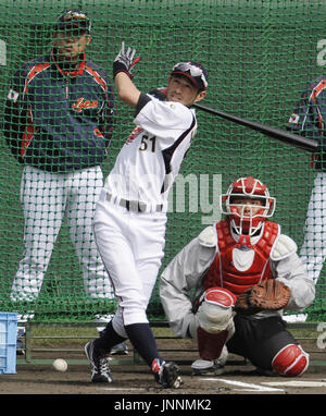 MIYAZAKI, Japan - Ichiro Suzuki, a Japan World Baseball Classic candidate  player, attempts a catch over his shoulder in Miyazaki, Kyushu, on Feb. 16  during team training for the tournament. (Kyodo Stock