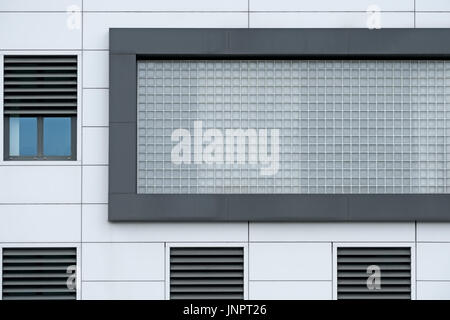 A modern commercial building with glass brick section Stock Photo