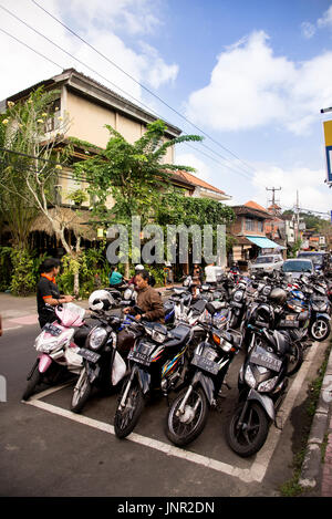 Bali, Indonesia - July 04, 2017. Parked various rental motorcycles textured background Stock Photo
