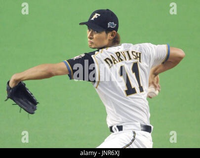 An elderly Japanese man watches a game of his home baseball team- the  Hokkaido Nippon Ham Fighters, at the Sapporo Dome Stock Photo - Alamy