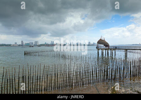Johore Baru coast as viewed looking North from from Singapore Sungei Buloh Wetland Reserve. Stock Photo