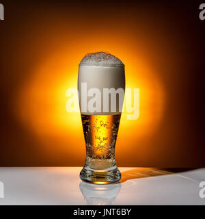 dark glass beer on light background, close up Stock Photo