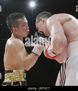 NAGOYA, Japan Challenger Takahiro Ao (R) of Japan lands a punch