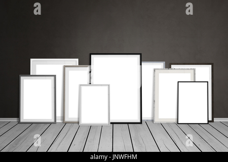 Multiple empty picture frames leaning on wall. Stock Photo