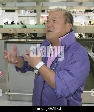 Hong Kong actor Eric Tsang poses with his trophy after winning the Best  Supporting Actor award for his movie Mad World during the 36th Hong Kong  Fil Stock Photo - Alamy