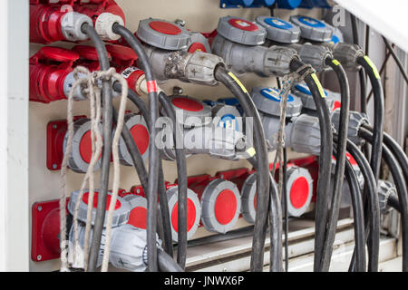 Temporary outdoors mobile distribution station, close-up view of power cables and sockets. Stock Photo