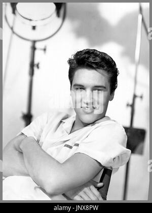 Elvis Presley relaxed smiling informal stills portrait in B&W on the 1958 movie film studio set of King Creole Paramount Studios Hollywood USA Stock Photo