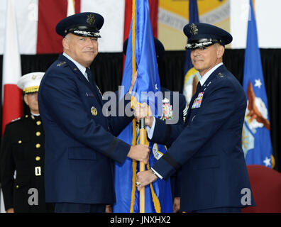 TOKYO, Japan - Lt. Gen. Salvatore Angelella (R) receives a Fifth Air Force flag (L) from U.S. Pacific Air Forces commander Gary North in a command-changing ceremony at Yokota Air Base in Tokyo on July 20, 2012. Angelella took over the top post of the U.S. forces in Japan from Lt. Gen. Burton Field. (Kyodo)