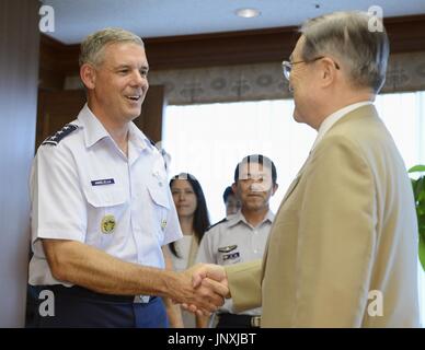 TOKYO, Japan - Japanese Defense Minister Satoshi Morimoto (R) and Lt. Gen. Salvatore Angelella shake hands before their meeting at the Defense Ministry in Tokyo on July 27, 2012. Angelella took over as commander of U.S. forces in Japan earlier in the month. (Kyodo)