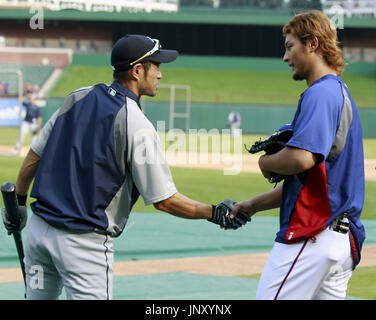 Los Angeles Angels two-way player Shohei Ohtani (L) shakes hands with  Seattle Mariners player instructor Ichiro Suzuki before a baseball game in  Seattle, Washington, on April 3, 2023. (Kyodo)==Kyodo Photo via Credit