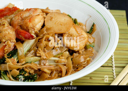 Stir fried flat rice noodle or char kway teow Stock Photo