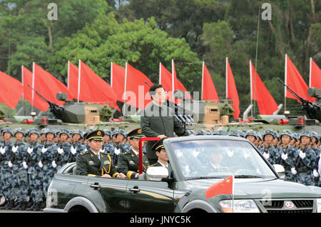 HONG KONG, China - Chinese President Hu Jintao stands in an open-top vehicle as he moves down a line of People's Liberation Army personnel stationed in Hong Kong on June 29, 2012. Hu began a three-day visit to Hong Kong to celebrate the 15th anniversary of its return to Chinese rule and to preside over the swearing-in of the territory's new administration. (Kyodo)