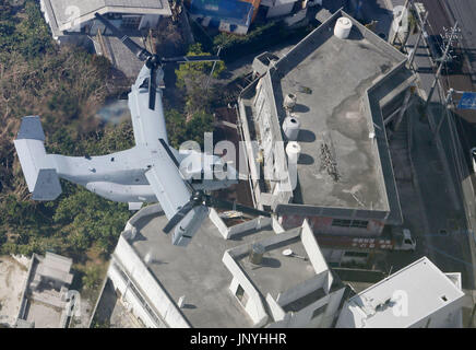 NAHA, Japan - Photo taken from a Kyodo News airplane shows U.S. Marine Corps' MV-22 Osprey aircraft flying over the city of Ginowan, Okinawa Prefecture, on Oct. 6, 2012. (Kyodo)