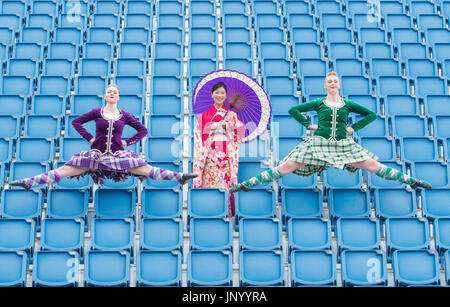 Edinburgh, UK. 31st Jul, 2017. Michiko Matsunaga Japeanese Defence force band, Scottish Dancer Caroline Drummond (Green) and Charlotte McFie (Purple) The Royal Edinburgh Military Tattoo reveals an array of international acts to celebrate this year's Splash of Tartan - Scotland's August extravaganza returns with a stellar line up of the world's best military performers The Royal Edinburgh Military Tattoo is set to celebrate, unveiling a stellar line up of acts set to descend on Scotland's capital for the 2017 Show today (Monday, 31 July). Credit: IAN GEORGESON/Alamy Live News Stock Photo