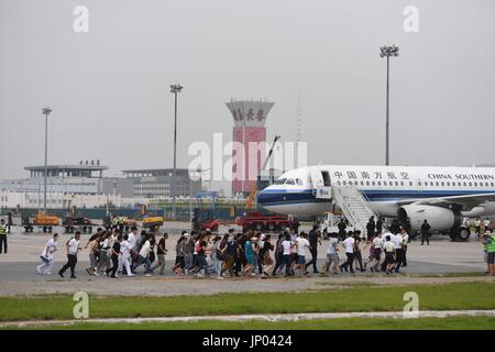 Changchun, China's Jilin Province. 1st Aug, 2017. Passengers are evacuated during a hijacked plane rescue simulation at an airport in Changchun, capital of northeast China's Jilin Province, Aug. 1, 2017. About 240 people from various units took part in the joint exercise. Credit: Zhang Nan/Xinhua/Alamy Live News Stock Photo
