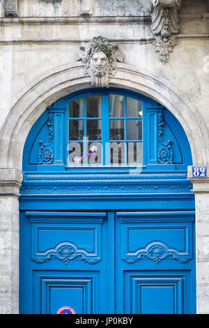 Paris, France - March 2, 2016: Imposing blue door in the Marais, Paris. Stock Photo