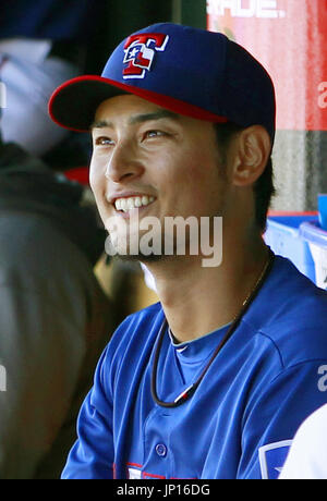 A newly-joined Texas Rangers Yu Darvish (L) shakes hands with his Iranian  father, Farsad Darvishsefad at Rangers Ballpark in Arlington, Texas, on  Jan. 21, 2012. The right-hand Japanese ace Darvish agreed to