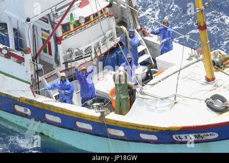 ISHIGAKI, Japan - Aerial photo taken by Kyodo News shows fishermen waving on a Taiwanese fishing boat in waters northwest of Ishigaki Island, Okinawa Prefecture, on May 10, 2013. A bilateral fishery agreement came into force the same day allowing Taiwanese fishing boats to operate in Japan's 200-nautical-mile exclusive economic zone near the Senkaku Islands in the East China Sea. (Kyodo)