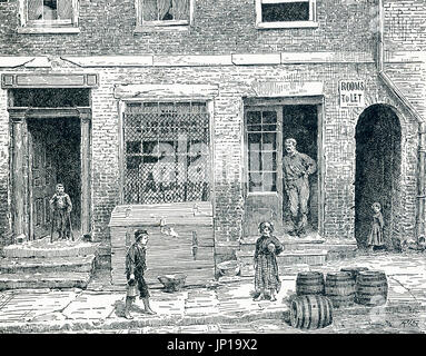 Entrance to a Tenement House and Alley The door at the left leads directly into a tenement. The archway at the right is a dark passage was leading to filthy yards and tenements in the year. Stock Photo