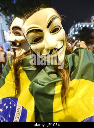 RIO DE JANEIRO, Brazil - Demonstrators wearing masks march in Rio de Janeiro, Brazil, on June 24, 2013. Protests triggered by transport fare hikes spread with participants showing their opposition to such issues as corruption and the amount spent on the 2014 FIFA World Cup. (Kyodo)