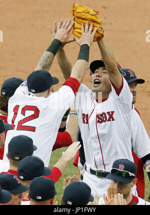 Shirtless Mike Napoli celebrates with helmeted Jonny Gomes 