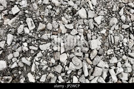 Top down view on a grey gravel stones texture. Background shot. Stock Photo
