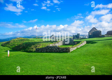 Scenery view of Peel Castle constructed by vikings on top of Peel hill on a clear blue sky, Isle of Man Stock Photo