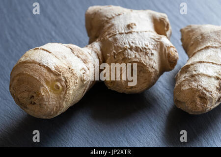 Fresh ginger root on a dark background Stock Photo