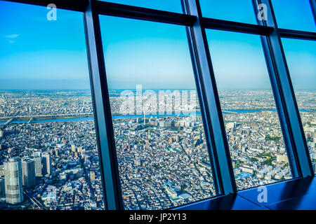 TOKYO, JAPAN - MAY 13: Aerial view of Tokyo cityscape through Tokyo Skytree Tower windows Stock Photo