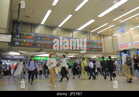 People commute at Shinjuku train station in Tokyo Japan. Stock Photo