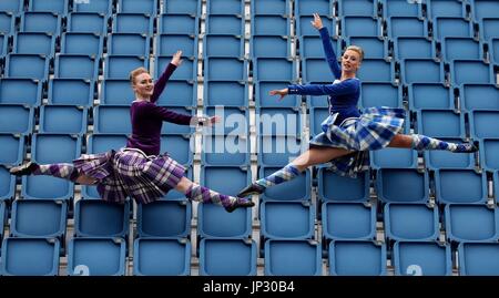 Highland Dancer l-r Charlotte McFie and Elayne Seaton from the Tattoo Dance Company perform in the stands on the Edinburgh Castle esplanade after the Royal Edinburgh Military Tattoo programme was revealed by Brigadier David Allfrey, chief executive and producer of the Tattoo. Stock Photo