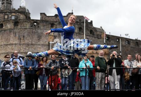 Highland Dancer Elayne Seaton from the Tattoo Dance Company performs on the Edinburgh Castle esplanade after the Royal Edinburgh Military Tattoo programme was revealed by Brigadier David Allfrey, chief executive and producer of the Tattoo. Stock Photo