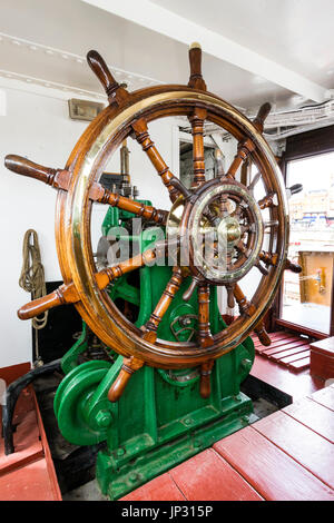 Restored, World war two stream tugboat, Cervia. Interior of the wheelhouse with ship's wheel. Stock Photo