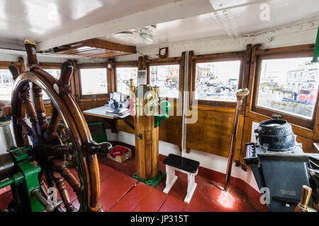 Restored, World war two stream tugboat, Cervia. Interior of the wheelhouse with bridge and ship's wheel. Stock Photo