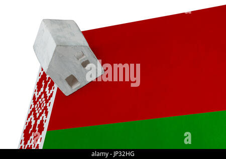 Small house on a flag - Living or migrating to Belarus Stock Photo