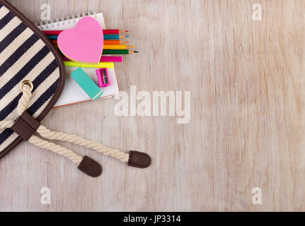 Top view of school supplies on wooden desk. Place for your text Stock Photo
