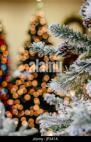 Christmas tree branches with lights on the wooden background Stock ...