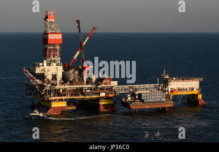 Oil rig platform on Lukoil Filanovsky oil field at the Caspian Sea, Astrakhan region, Russia Stock Photo