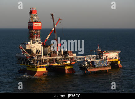 Oil rig platform on Lukoil Filanovsky oil field at the Caspian Sea, Astrakhan region, Russia Stock Photo