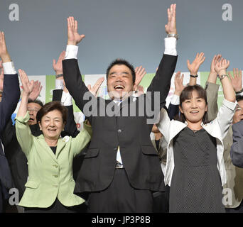 OTSU, Japan Former lawmaker Taizo Mikazuki (R) receives flowers from