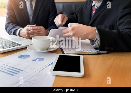 Team work process young business managers crew working with new startup project ,discussting and analyse graph plans Stock Photo